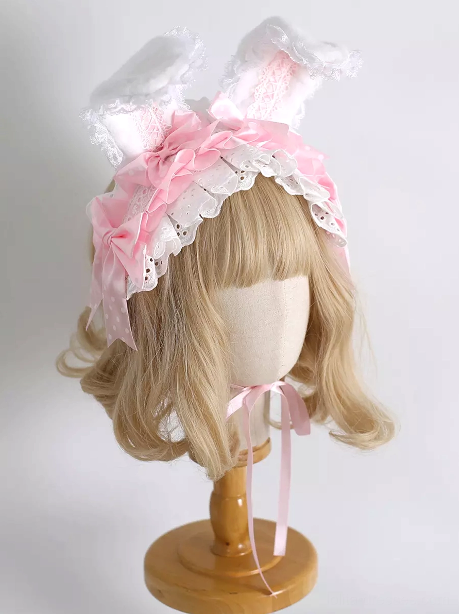 Pink polka-dot bow lolita bunny ear headband with pink ruffled trim and white lace edge right front angle