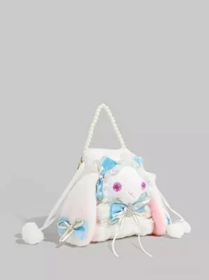 Three-quarter front view of lolita bunny plush crossbody bag featuring white plush body, blue satin bows, and pink inner ears kawaii design