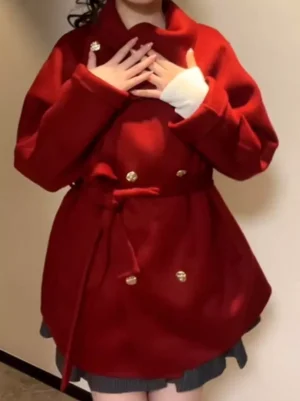 Vintage-inspired lolita belted overcoat in burgundy with double-breasted gold buttons and adjustable waist sash, full model upper body shot