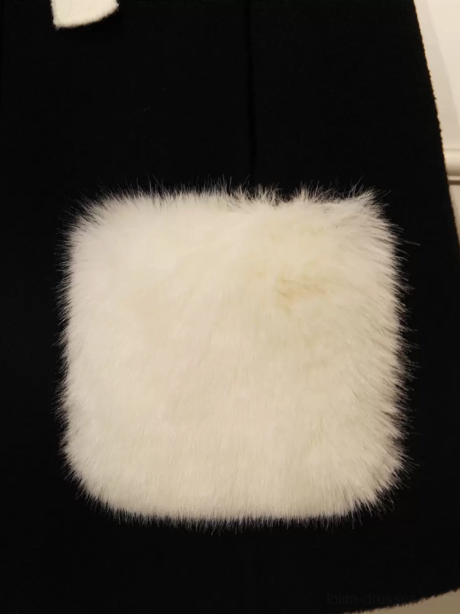 Close-up texture detail of lolita cape coat square fuzzy white pocket showing soft plush fabric quality