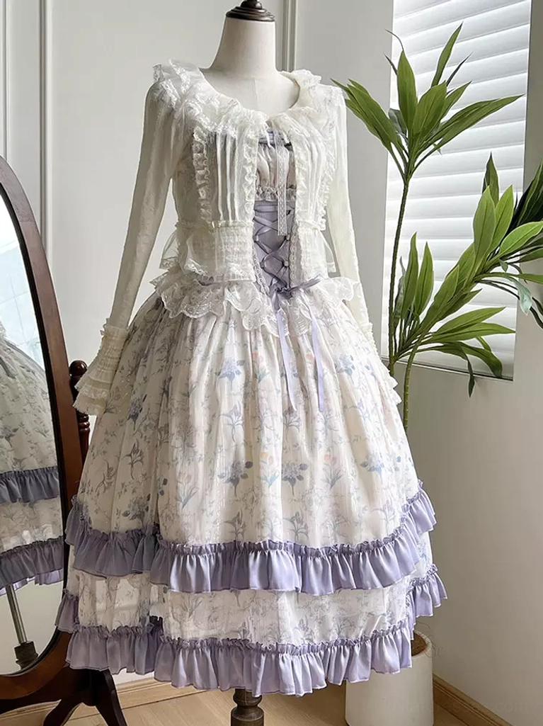 White lolita cardigan with puff sleeves layered over lavender-trimmed tiered skirt on dress form mannequin full outfit coordination