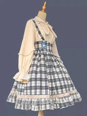 Side view of light sky blue lolita suspender skirt with cross back straps and lace-up waist detail on studio mannequin