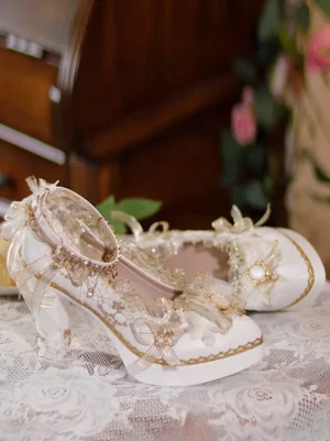 Lolita pumps side profile showing ankle strap gemstone accents and sheer lace upper detail