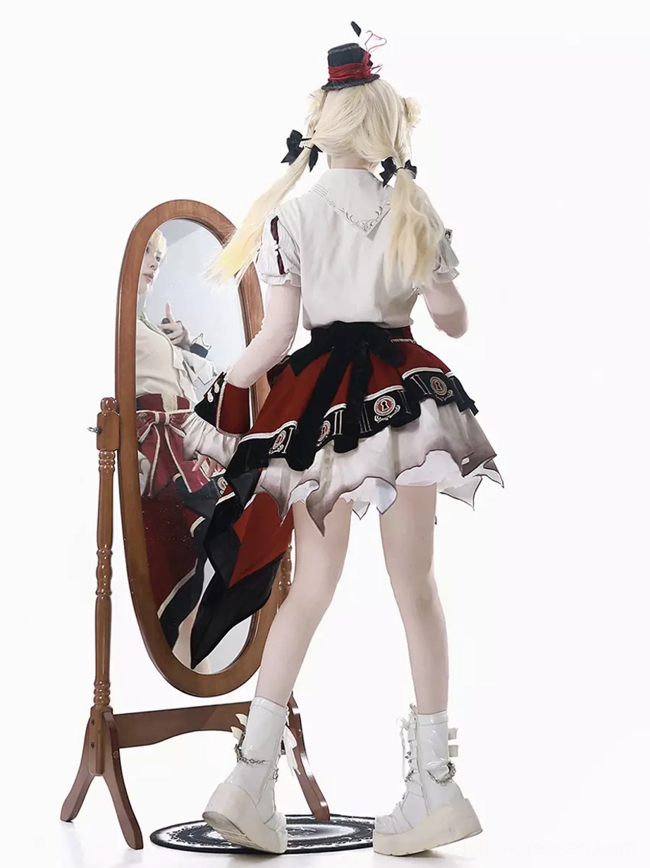 Back display of lolita outfit showing white blouse back and high-low ruffle skirt trim on blonde model with twin braids in white studio