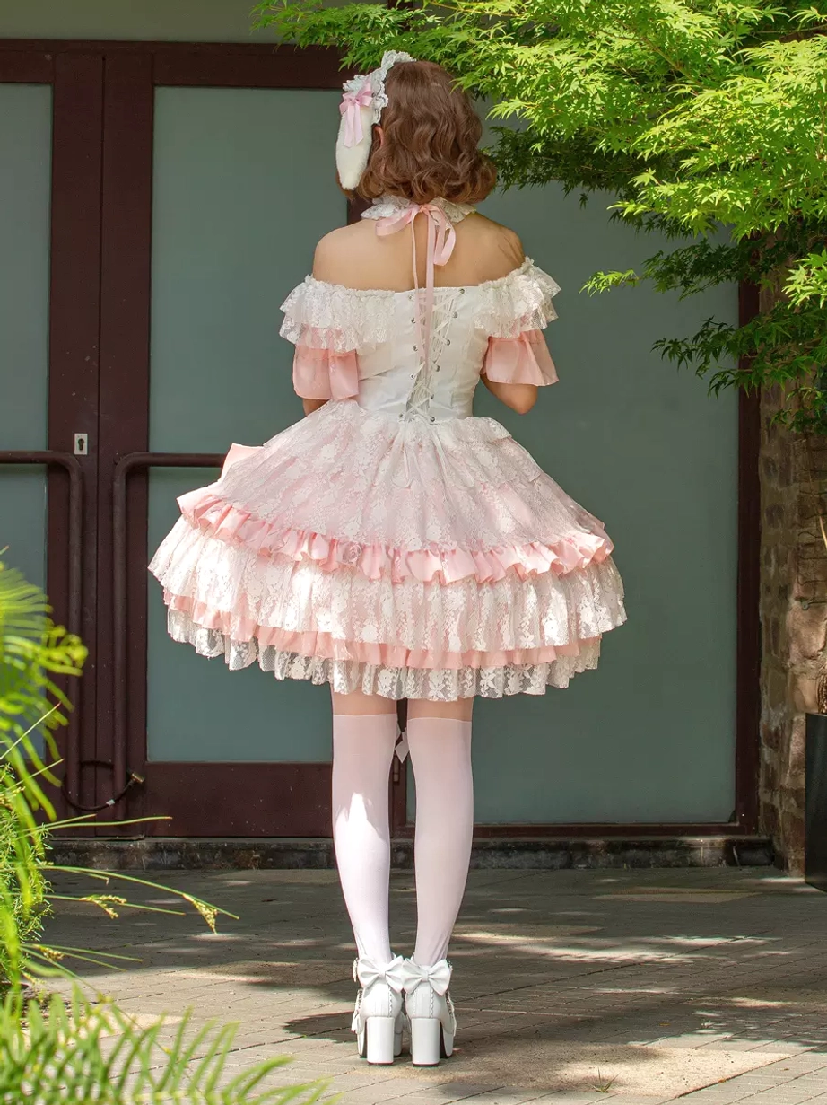 Sweet lolita dress back view showing exposed back tie closure white platform heels and lace hem trim detail