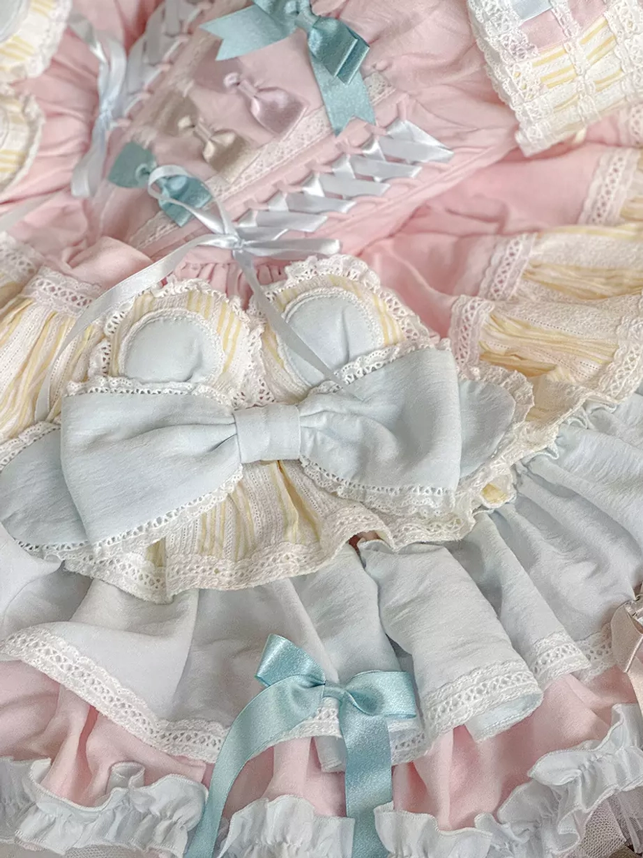 Close-up Lolita dress details satin bow ribbon accents ruffled lace pastel mixed colors texture embellishments design elements zoom view