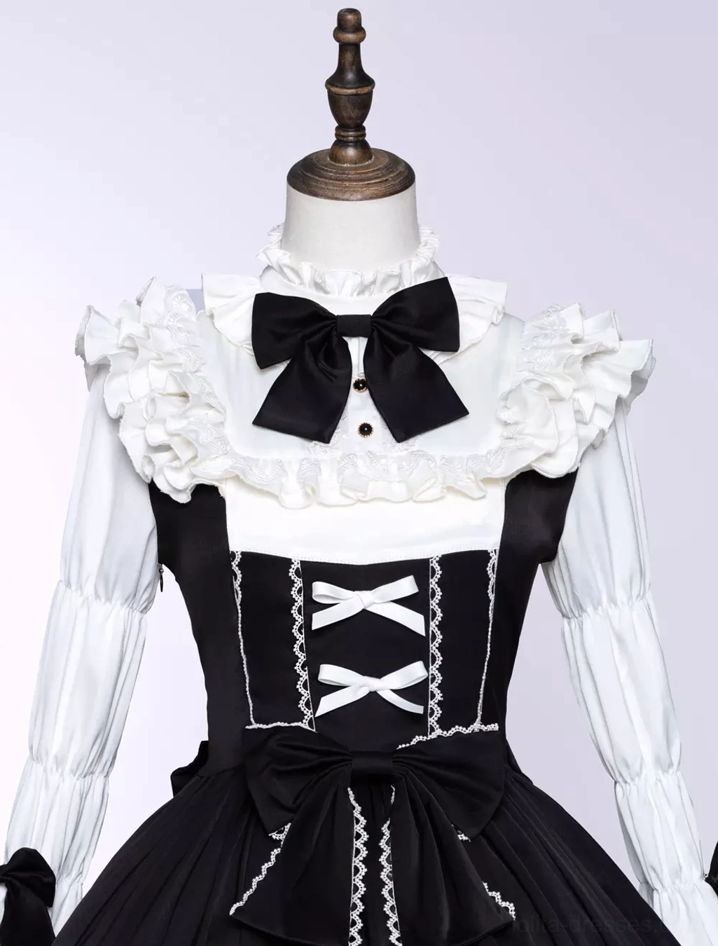 Gothic lolita dress sleeve detail showing long ruffled cuffs, lace trim, bell-shaped design, and Victorian-inspired tailoring