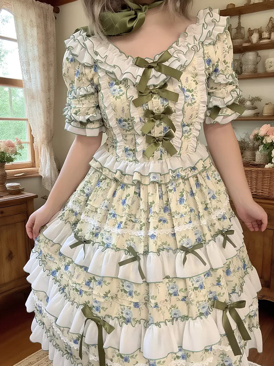 Short sleeve floral lolita dress front medium shot puff sleeves ruffled neck trim tiered skirt window background