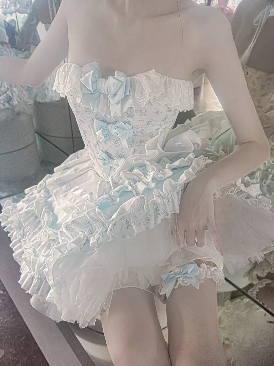 Lolita dress set model styling detail view showing bow embellishments ruffled layers off-shoulder neckline romantic sweet lolita fashion theme