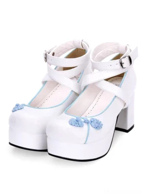 Embroidered lolita platform pumps with dual cross-ankle straps and floral embroidery, front three-quarter view of paired shoes on white background showcasing white upper and blue floral embroidery details
