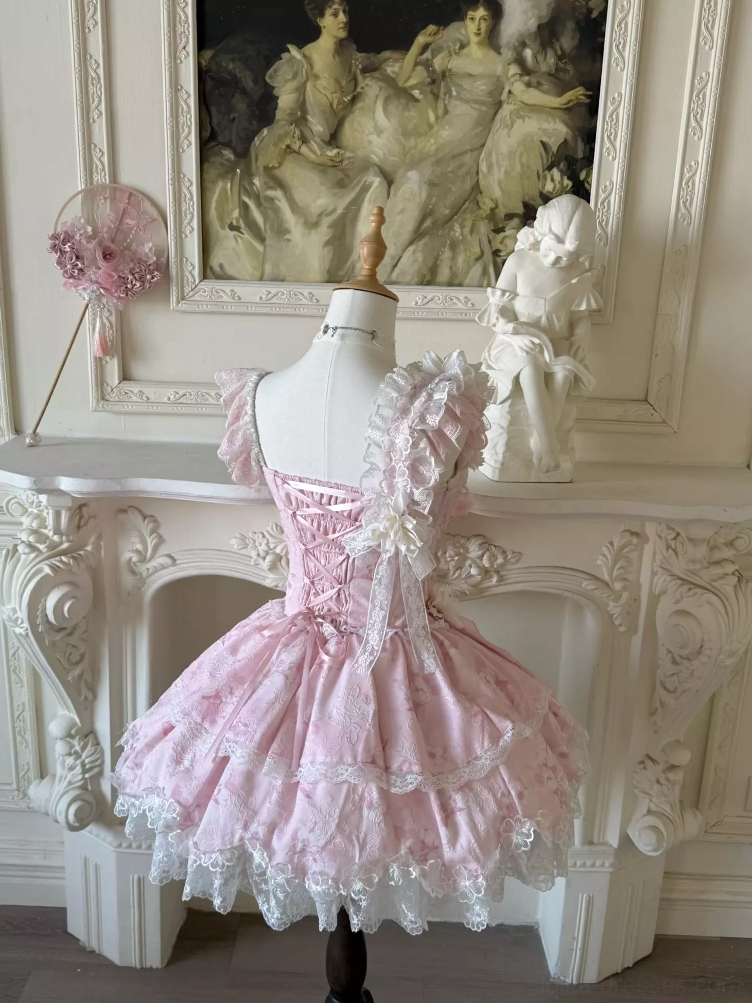 Spaghetti strap and neckline detail of sweet lolita fairy dress showing floral lace applique and corset bodice construction