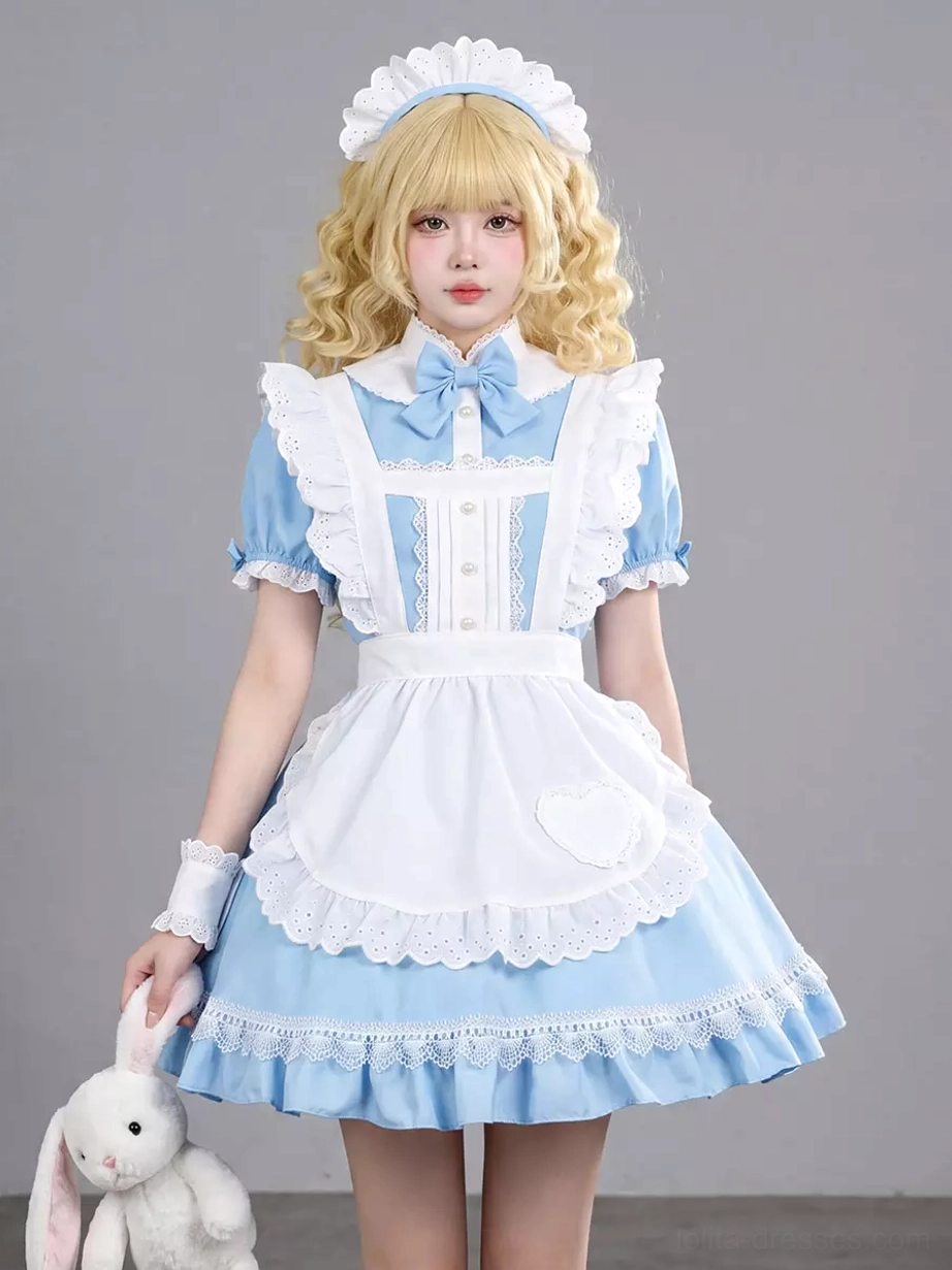 Blue french maid lolita dress front three-quarter angle showing heart-shaped pocket on white apron, lace-trimmed blue skirt hem, white wrist cuffs, and detailed embellishments