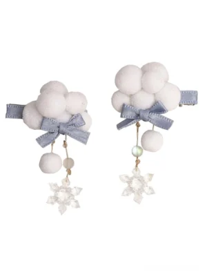 Flat lay overhead display of matching pair of light sky blue Lolita hair clips with asymmetric bead pendants, snowflake charms and white cloud pompom designs on white background, showing both accessories together