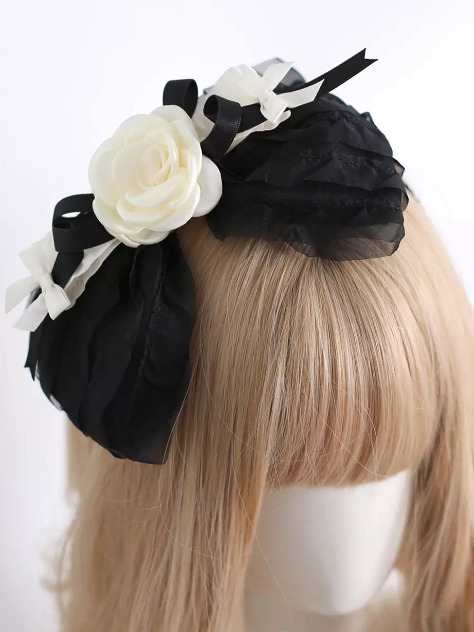 Right three-quarter view of classic Lolita hair hoop headdress with asymmetrical decorative layout, dual black-white fabric sets, and layered accessories on light golden wig