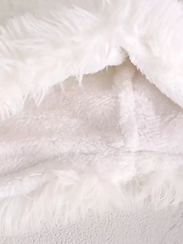 Top-down close-up interior detail of soft fluffy white lolita hat lining showing smooth fleece texture, comfort padding, quality construction detail