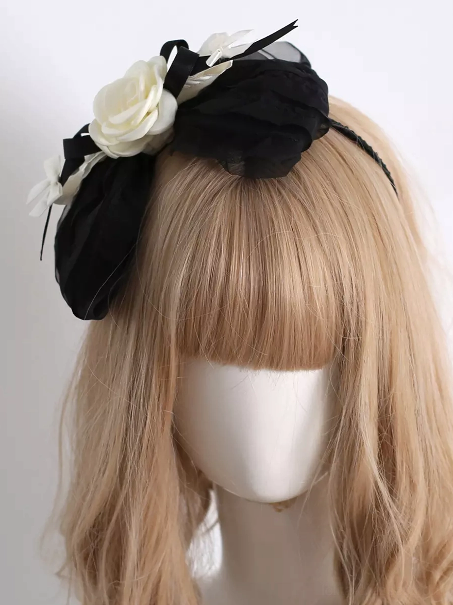 Front head-on view of classic Lolita KC headwear headdress on mannequin with light golden bangs wig, showcasing large black mesh bow and cream flower decoration centerpiece