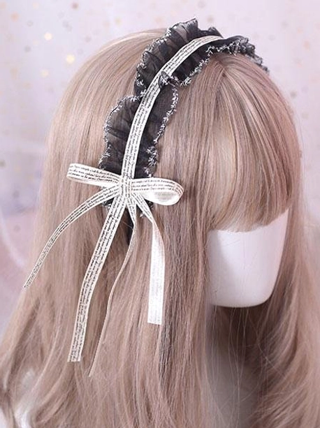 Off-white satin ribbon lolita headdress with black ruffled lace and silver accents displayed from rear view on mannequin showing elegant tailing ribbons