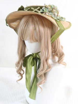Sweet lolita straw hat front three-quarter angle featuring green ribbons and botanical flower decorations with brim trim