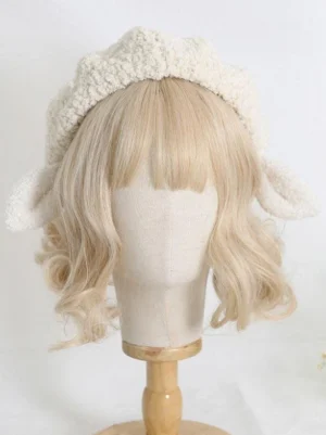 Left side profile of plush pink-tipped sheep ears lolita headdress worn on mannequin, showing ruffled beret brim and fuzzy fleece fabric texture, cute lolita fashion hat accessory