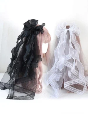 Dual Lolita bow hair veils shown from rear view in black and white colorways on mannequins with pink wigs, showcasing multi-layered organza bow construction