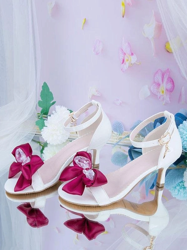 Lolita stiletto heel sandals white leather burgundy satin bow overhead flat lay with mirrored reflection