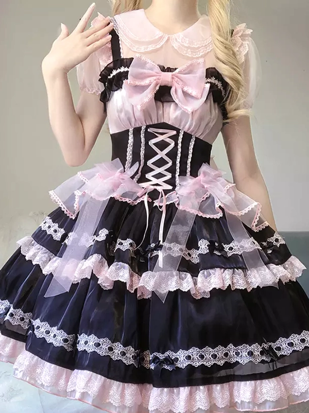 Sweet lolita JSK dress front angle featuring Peter Pan collar detail, large front bow, corset lace-up bodice design, complete coordinate presentation