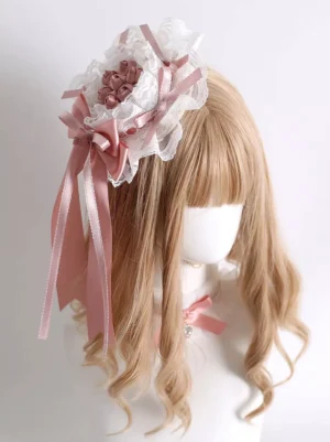 Delicate lolita headdress with crisscross satin ribbons and ribbon tails displayed right front angle showing heart choker coordination