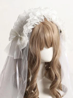 Front partial view of romantic lolita headwear featuring delicate ruffled lace headband, single satin bow, and ethereal sheer tulle overlay veil on display mannequin