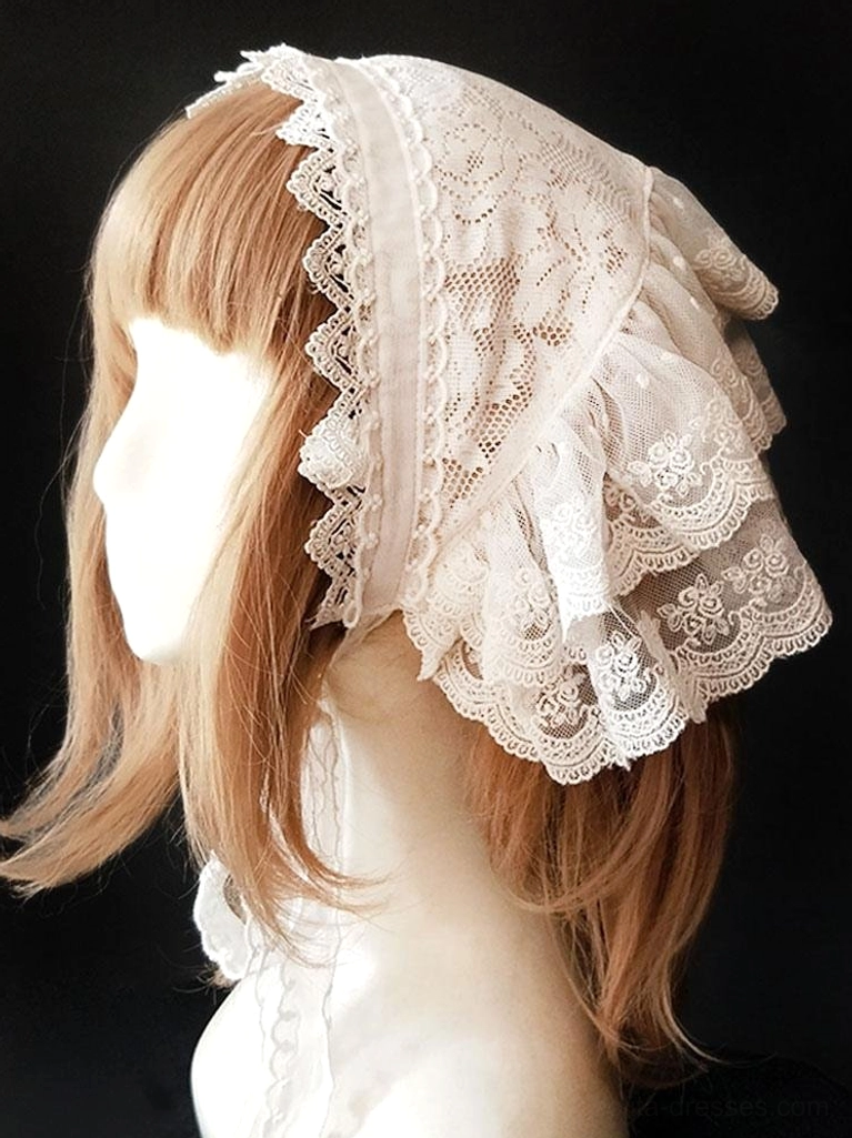 Right side profile of white lace lolita headdress displaying double-layered ruffled design with floral embroidered accents