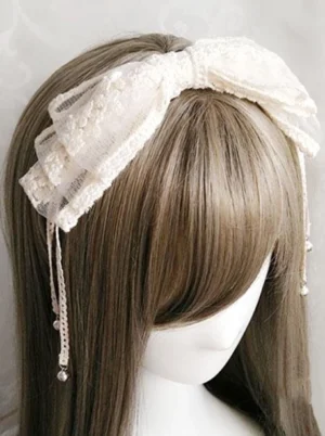 Lolita off-white lace katyusha headband with multi-layer ruffled bow and pearl drop accents worn on mannequin with long ash brown hair, front eye-level view showcasing the elegant headdress design and wearing effect for classic lolita tea party coordinate
