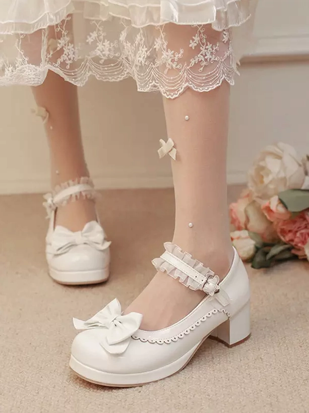 Pastel Lolita pumps close-up detail view emphasizing Mary Jane buckle strap, block heel construction, bow decoration, and premium patent leather material quality