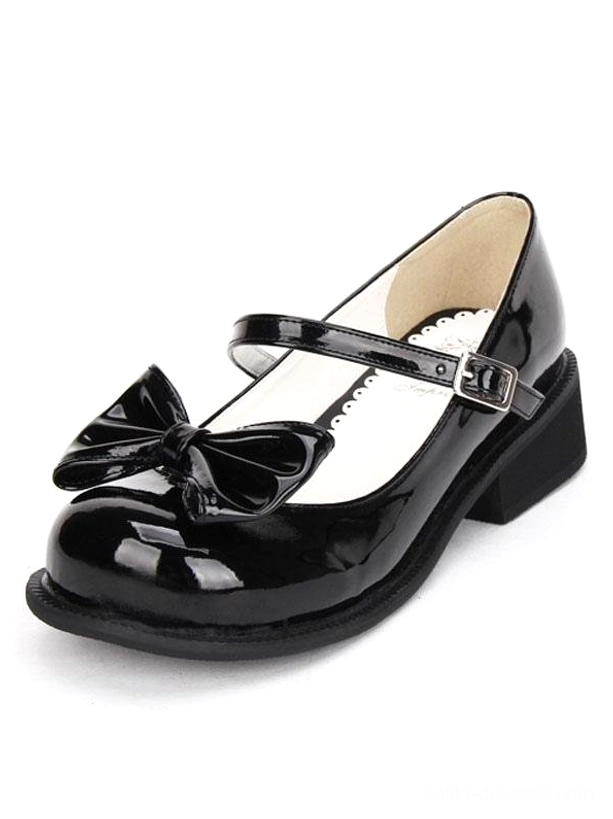 black patent leather mary jane lolita shoe front three quarter view chunky low heel front bow ornament round toe silhouette detail