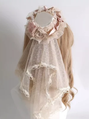 Full rear view of lolita mini hat featuring lace-trimmed polka dot tulle veil and layered floral ornaments on blonde-haired mannequin