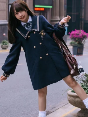 Navy Blue Lolita Overcoat three-quarter side view showcasing puffed sleeves and striped cuffs on model with crossbody bag