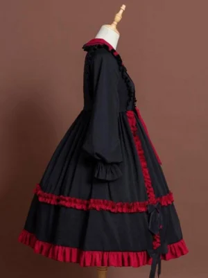 Classic Lolita one-piece dress side profile showing long lantern sleeves with ruffled cuffs and tiered skirt silhouette
