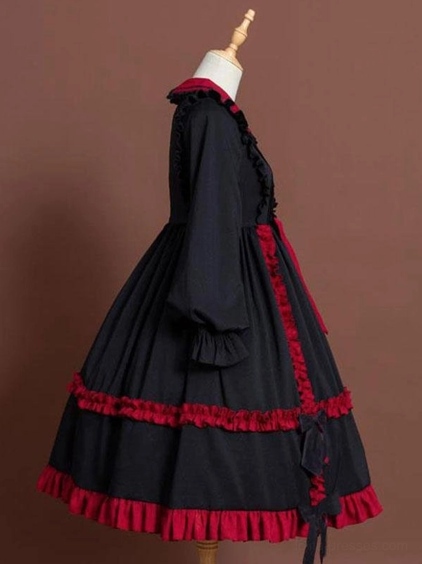 Classic Lolita one-piece dress side profile showing long lantern sleeves with ruffled cuffs and tiered skirt silhouette
