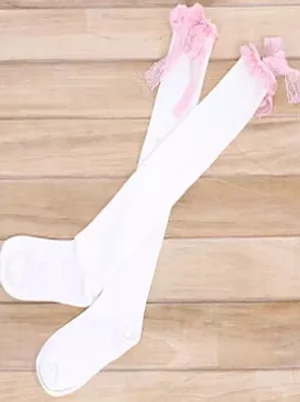 Pair of white lolita over-the-knee cotton socks with delicate pink lace bow embellishments at cuff flat lay overhead wooden table background