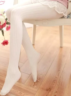 Off-white pinstripe lolita socks with subtle vertical stripe pattern worn seated with lace skirt on wooden floor, demonstrating full coverage and elegant drape