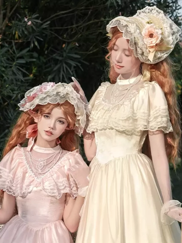 lolita girls wearing layered pearl necklaces with decorative bonnets vintage style close-up foliage background