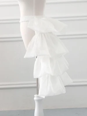 Side profile view of multi-tiered white sheer organza lolita petticoat showing bell-shaped silhouette and dimensional ruffle construction