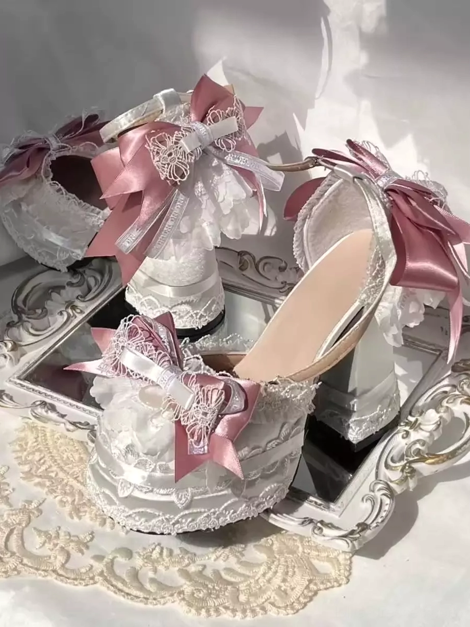 Pair of rococo lolita high heel shoes front view chunky heel back heel bows front decorative bows tea party style