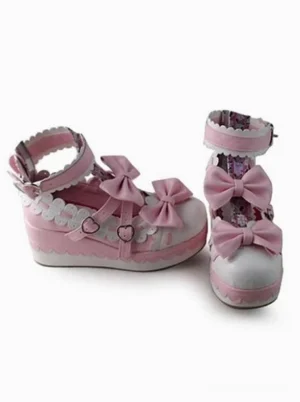 Lolita platform pumps side and front angle view showcasing heart-shaped buckle straps scalloped side trim and decorative printed inner shoe lining characteristic of Sweet Lolita style