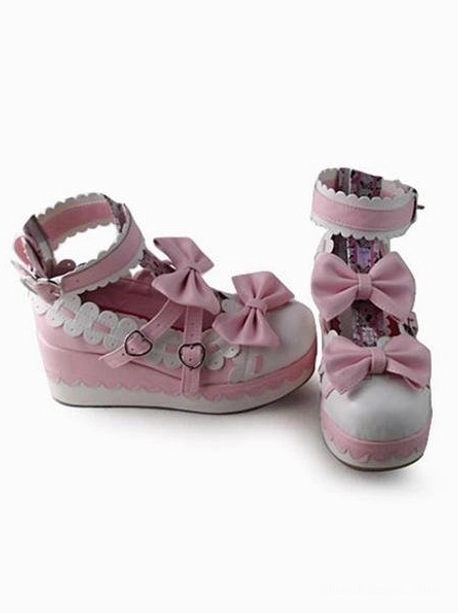 Lolita platform pumps side and front angle view showcasing heart-shaped buckle straps scalloped side trim and decorative printed inner shoe lining characteristic of Sweet Lolita style