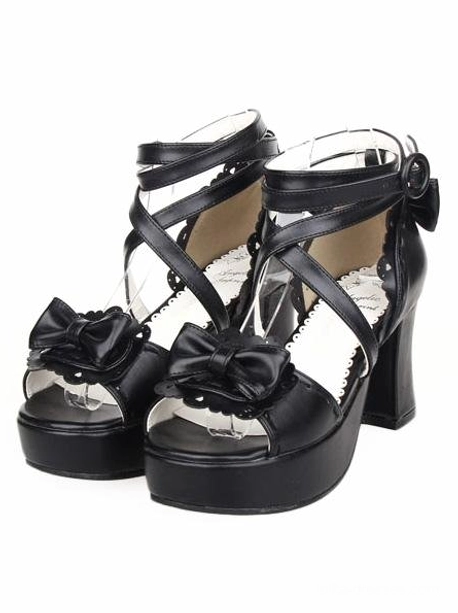 Black lolita platform sandals rear three-quarter view featuring ankle strap with side bow fastener, peep toe design, and chunky block heel structure