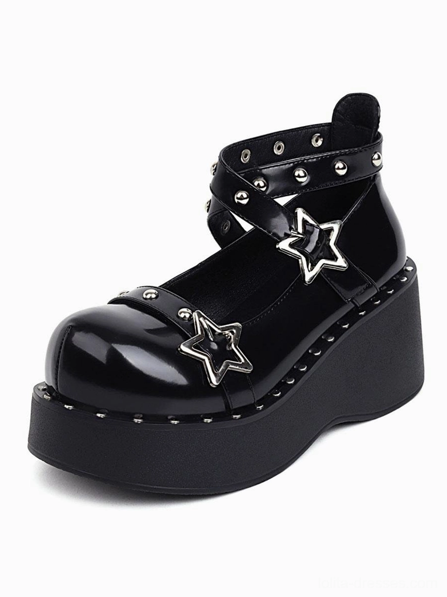 Single black lolita wedge heel shoe front close-up displaying high platform, multiple studded ankle straps, and shiny patent leather finish
