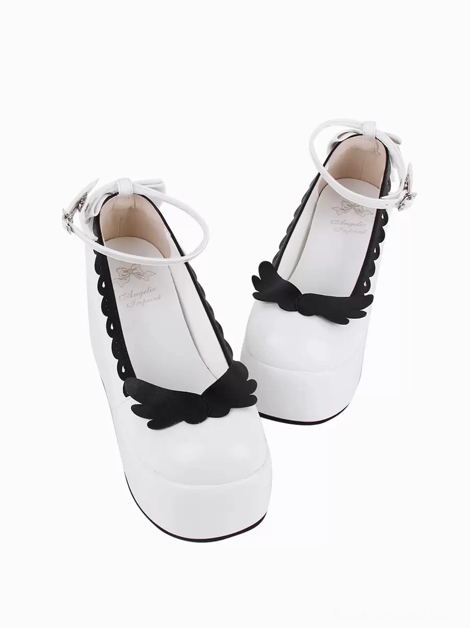 Lolita platform shoes tilted side paired view staggered angles black butterfly decoration scalloped trim white PU leather