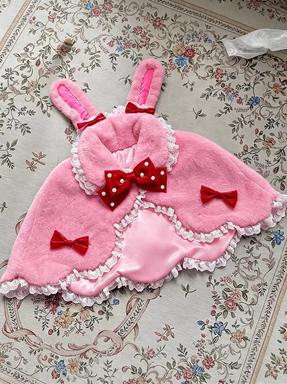 Lolita plush bunny ear cape detail shot highlighting scalloped hem construction, lace trim quality, and bow embellishment craftsmanship