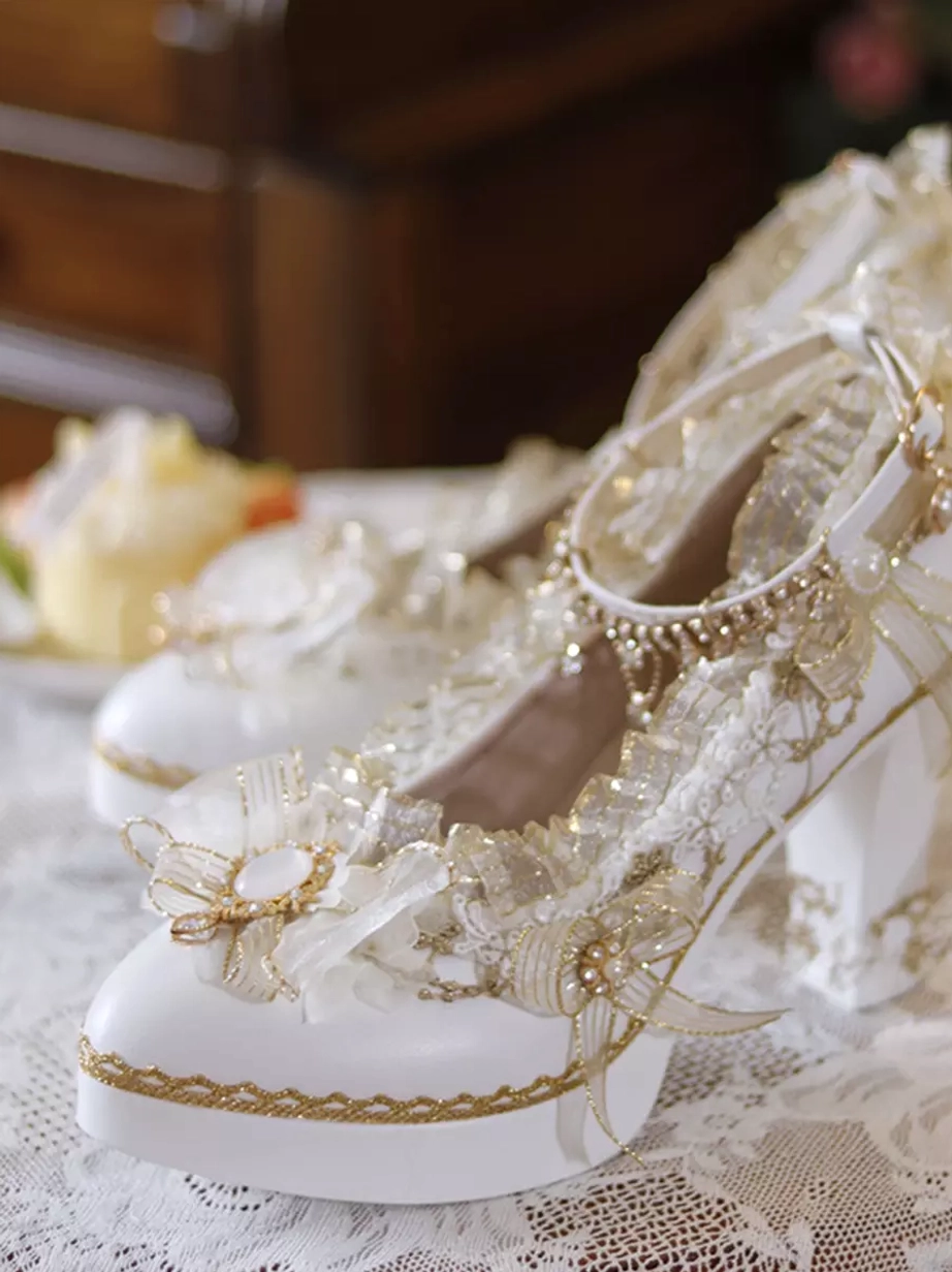 Paired sweet lolita shoes high-angle view with gold thread trims and toe flower bow embellishments