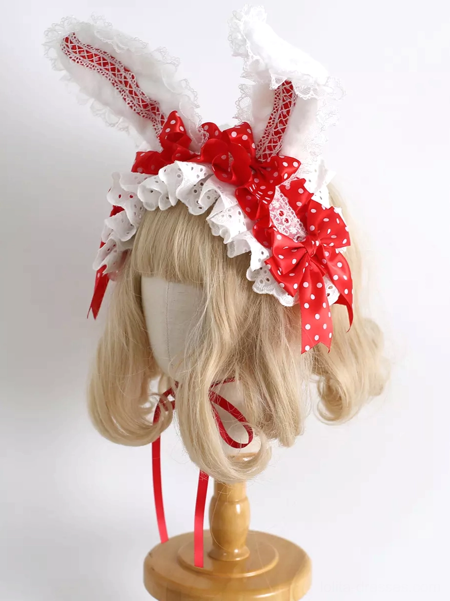 Red polka-dot lolita bunny ear hairband with red inner ear lace and white ruffled trim right front angle
