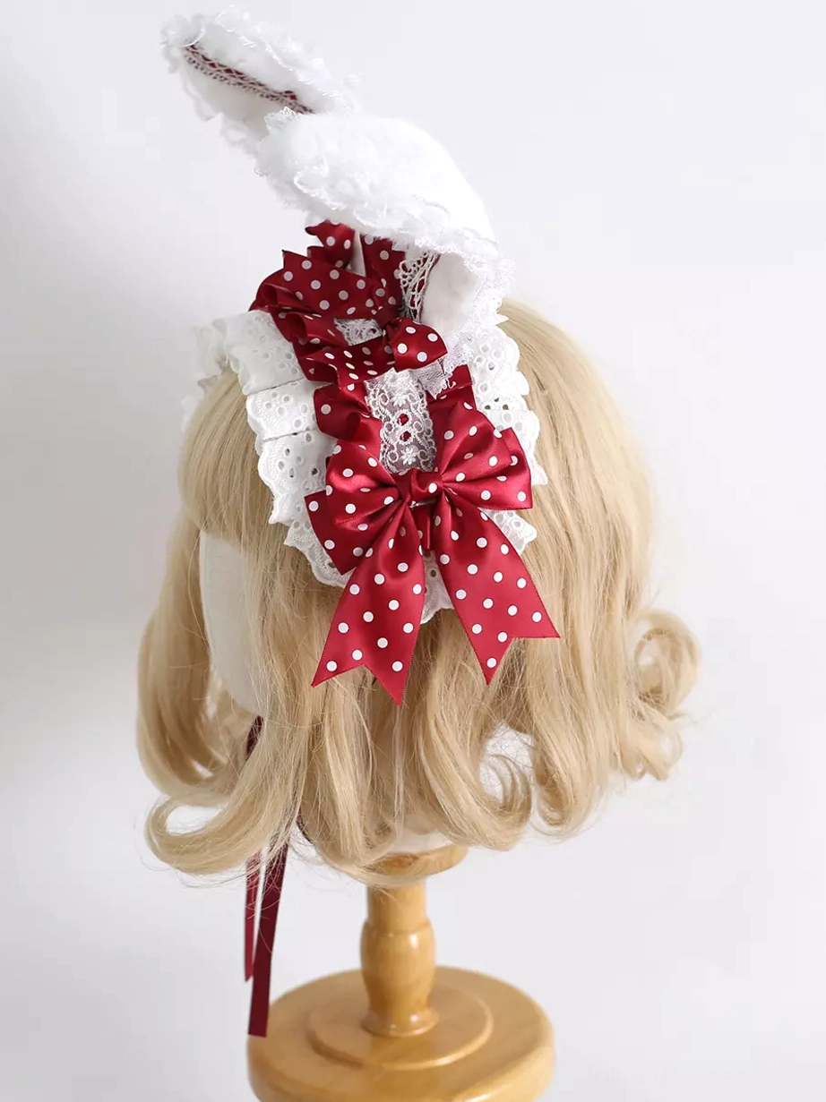 Red polka-dot lolita rabbit ear headband back three-quarter view with tilted ear and white frilled lace